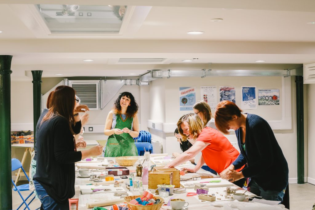 People taking part in an arts and craft class in Malt Cross workshop