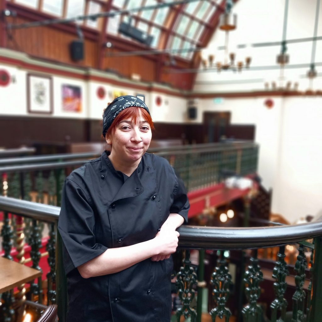 Rose our new chef at Malt Cross stands on the balcony of the pub.